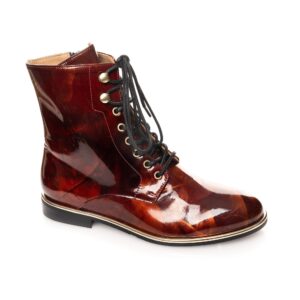 Luxury women’s brown patent leather biker boot with gold eyelets and black laces