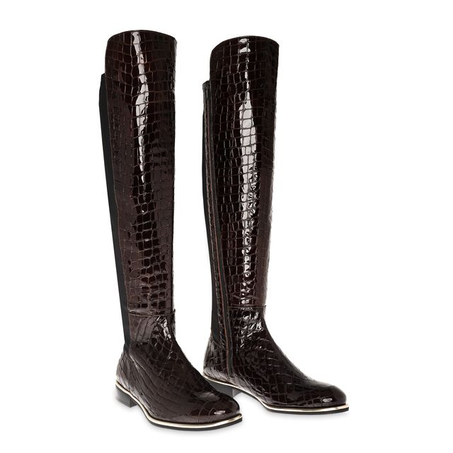 Flat knee-high chocolate croc leather boot with black stretch back panel, full-length inner zip, and gold rim detail — Nicola Sexton AW25.