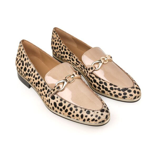 Neutral animal print loafer with cream and black cowhide, nude patent leather detailing, and a gold buckle – luxury flat shoe
