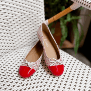 Red and white glitter ballet pump with red patent toe cap and bow, handmade in Italy by Nicola Sexton